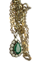 Collier or gris 18K ornée d'une émeraude centrale et de 12 diamants faisant le contours