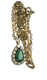 Collier or gris 18K ornée d'une émeraude centrale et de 12 diamants faisant le contours