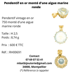 Pendentif en or 750 monté d'une aigue marine ronde