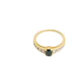 Bague or jaune 750, 8 diamants avec un saphir au milieu
