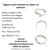 Bague or gris 750 mettant en valeur un diamant