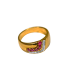 Bague or jaune 750 avec pierres rouges