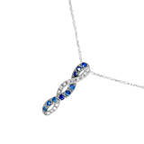 Parure en or gris 750 collier et boucles d'oreille saphir